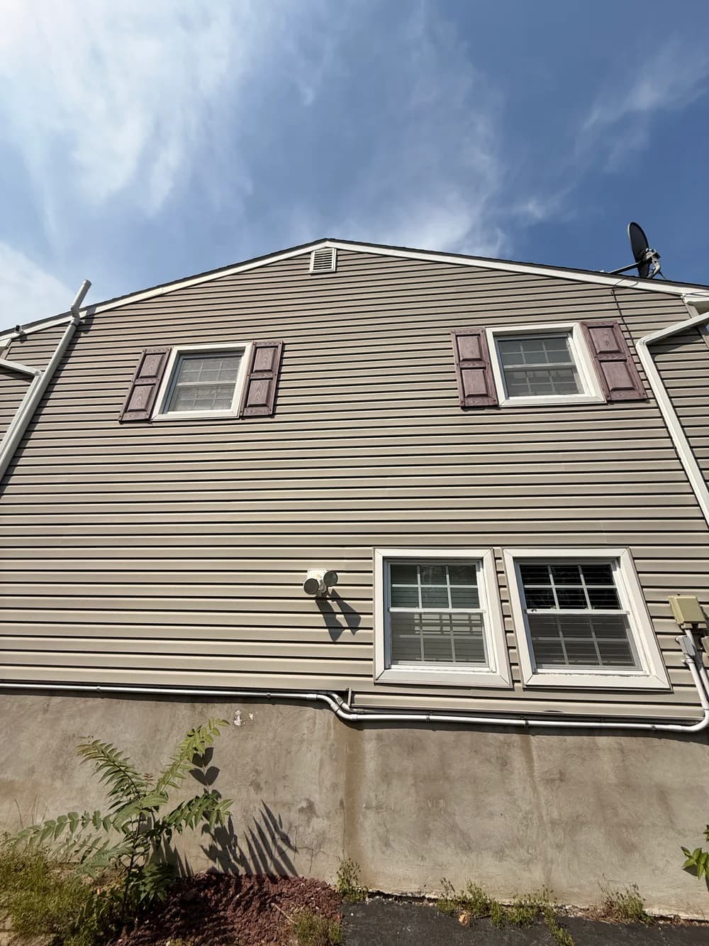 Original supplied photo of the siding after cleaning, photographed from a different angle.
